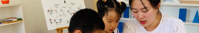 Elementary guide and children discussing document