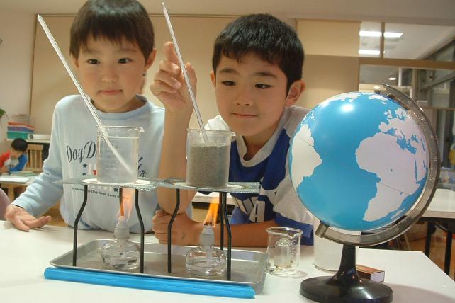 Elementary children doing a science experiment