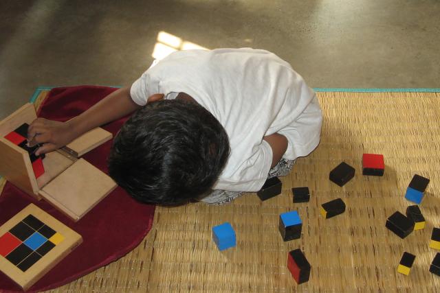 Child using trinomial cube
